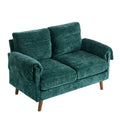 **Comfortabele groene stoffen bank met houten poten**